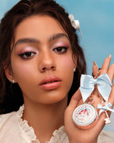 Bunny Garden Lip Balm & Charm with blue style held in hand 