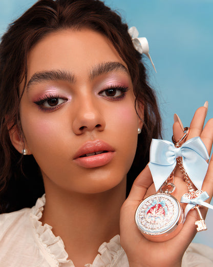 Bunny Garden Lip Balm &amp; Charm with blue style held in hand 